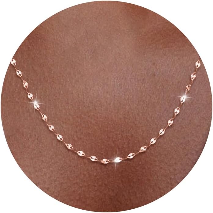 Fine flat mirror-link chain necklace worn at the collarbone