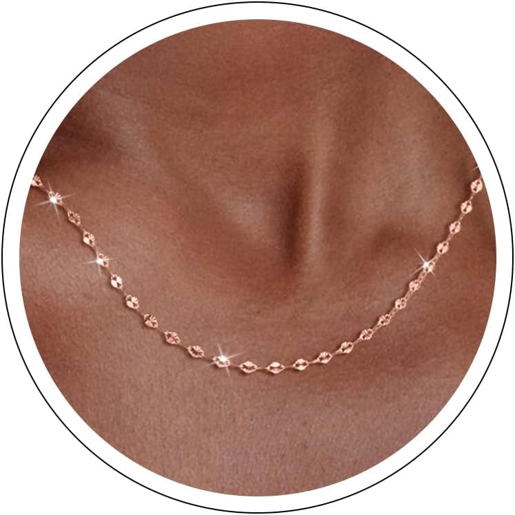 Fine flat mirror-link chain necklace worn at the collarbone