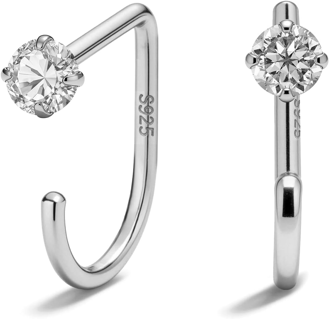 Small half hoop huggie earrings shown in several designs