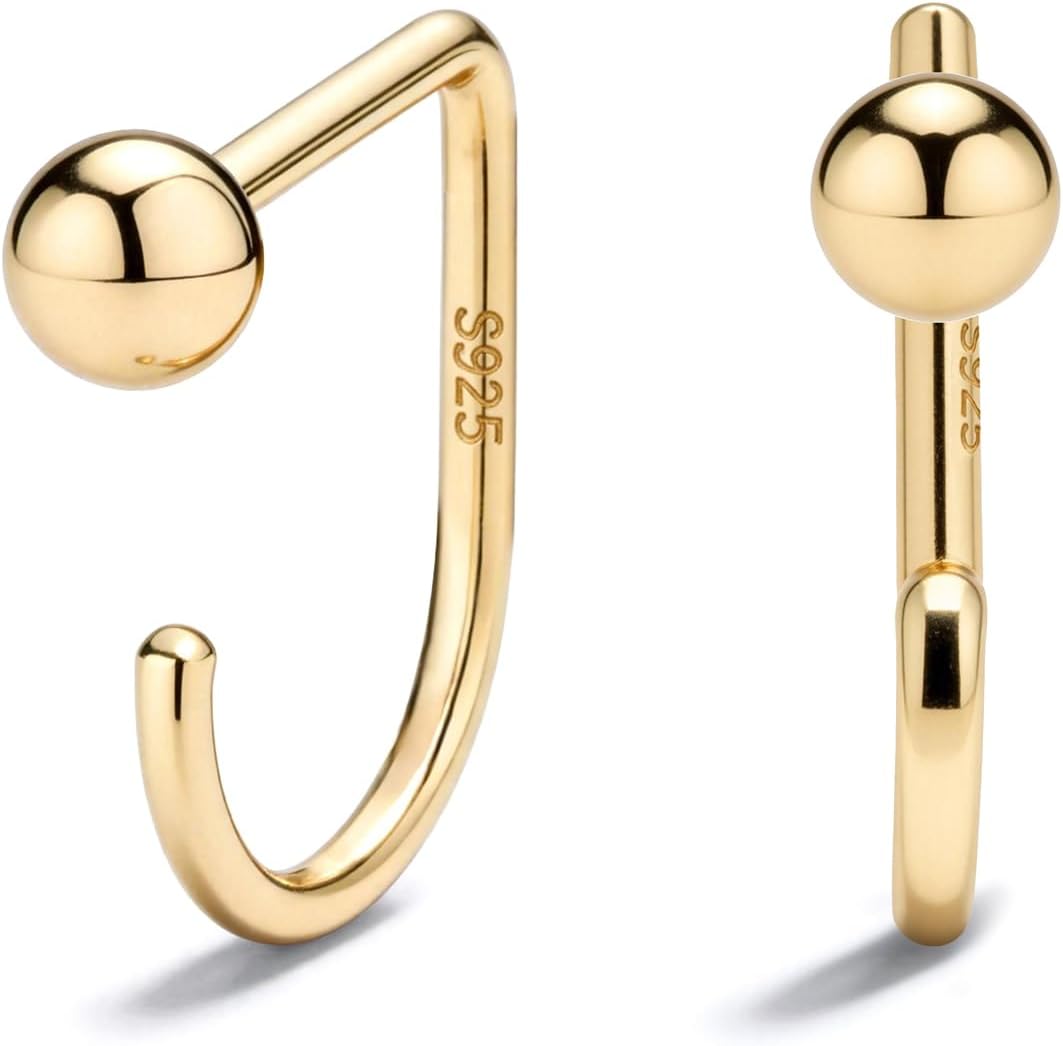 Small half hoop huggie earrings shown in several designs