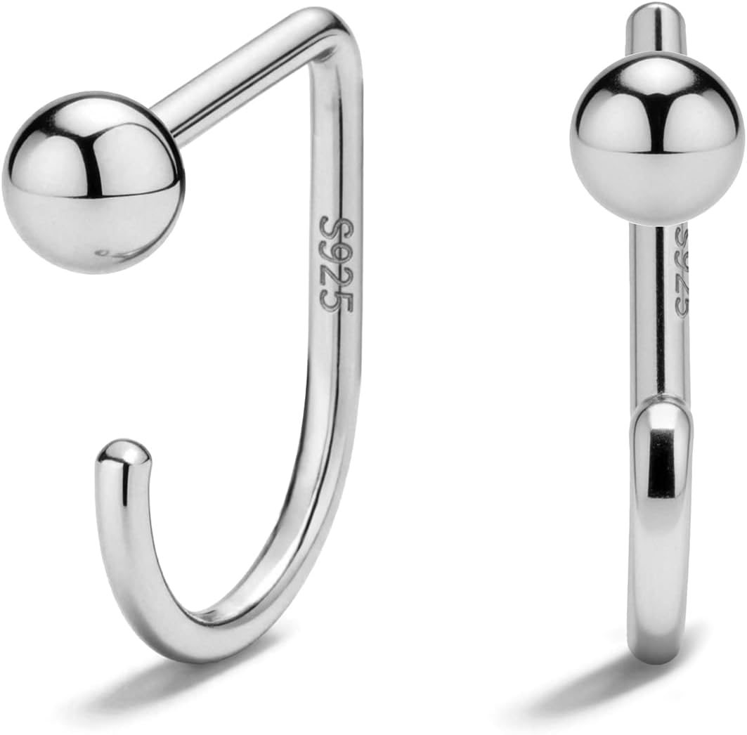 Small half hoop huggie earrings shown in several designs