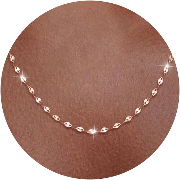 Fine flat mirror-link chain necklace worn at the collarbone