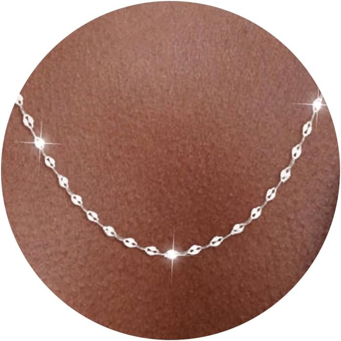 Fine flat mirror-link chain necklace worn at the collarbone