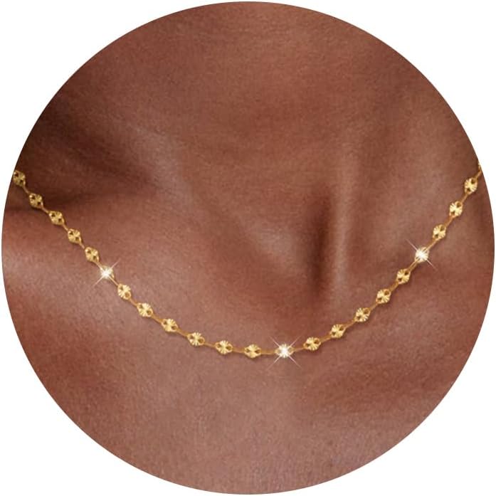 Fine flat mirror-link chain necklace worn at the collarbone
