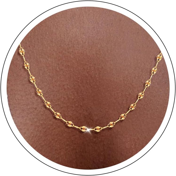 Fine flat mirror-link chain necklace worn at the collarbone