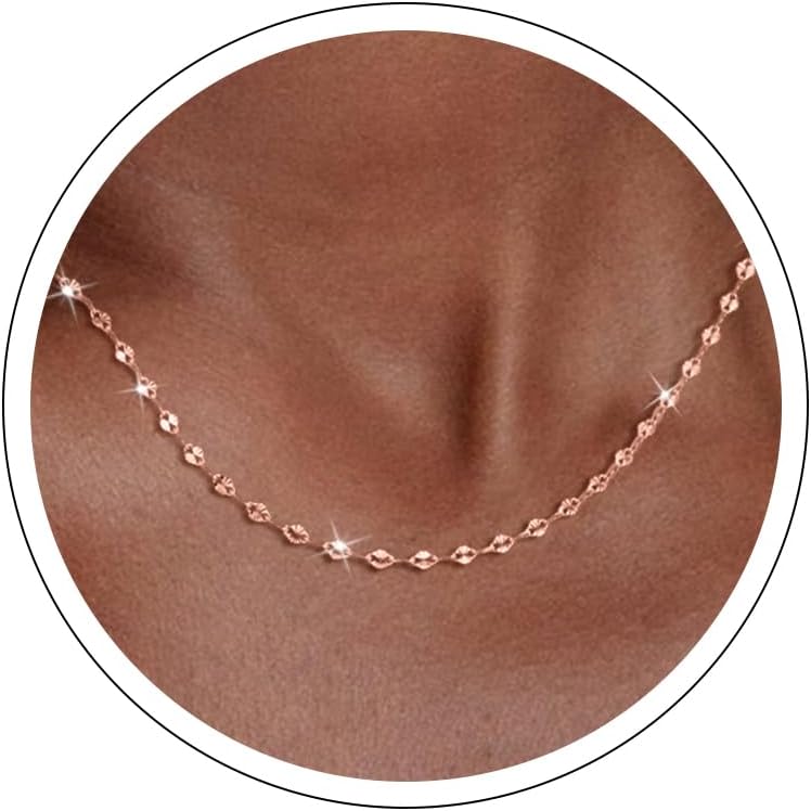 Fine flat mirror-link chain necklace worn at the collarbone