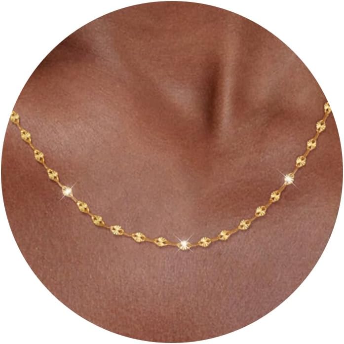 Fine flat mirror-link chain necklace worn at the collarbone