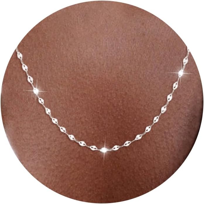 Fine flat mirror-link chain necklace worn at the collarbone