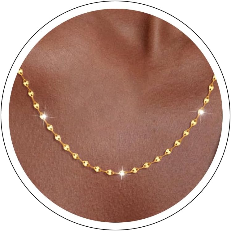 Fine flat mirror-link chain necklace worn at the collarbone