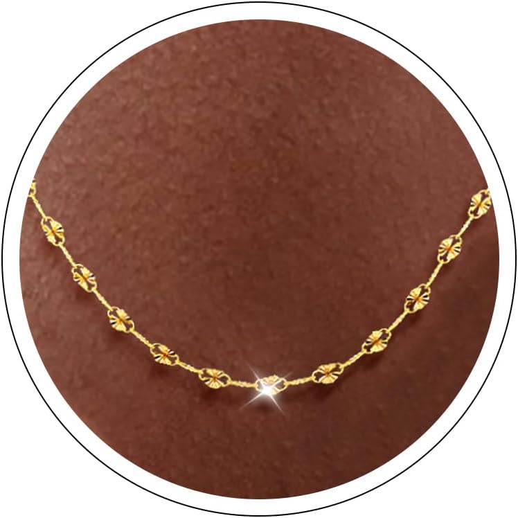 Fine flat mirror-link chain necklace worn at the collarbone