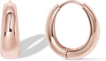 Chunky small hoop earrings with a thick rounded profile