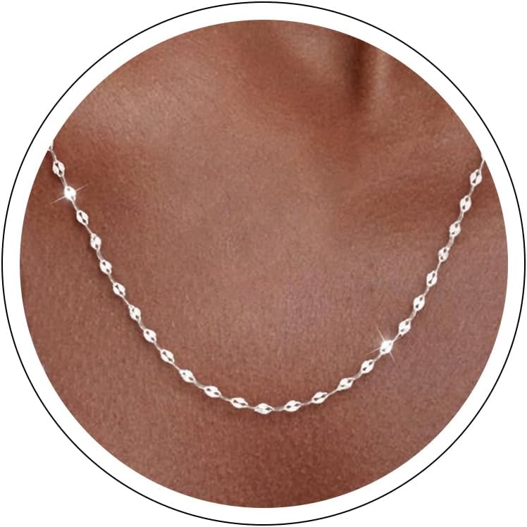 Fine flat mirror-link chain necklace worn at the collarbone