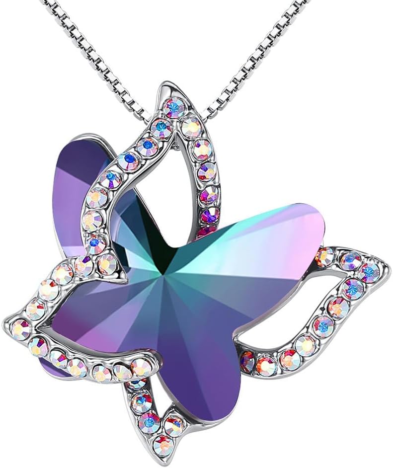 Faceted crystal butterfly pendant with a pave silver-tone wing overlay