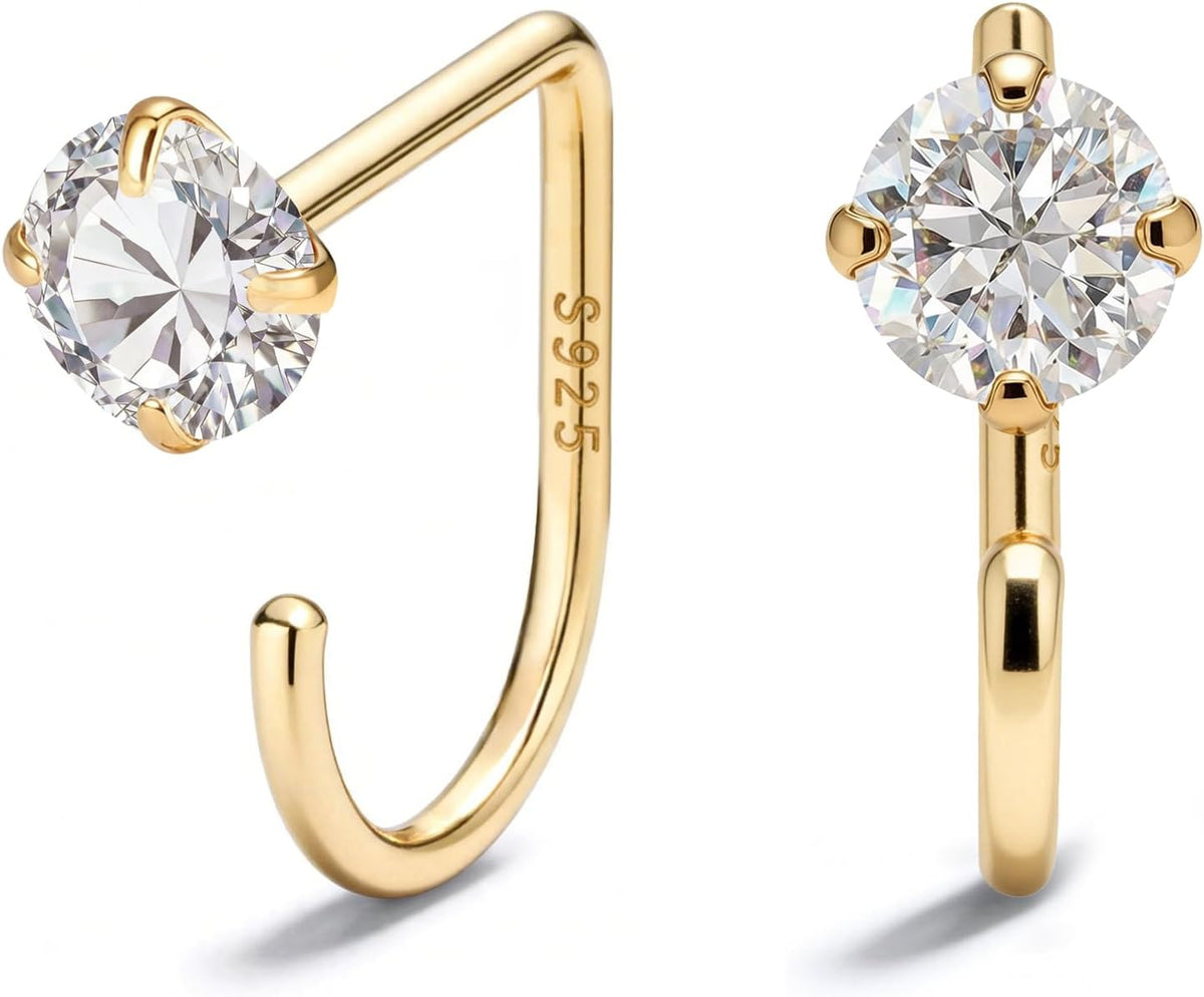 Small half hoop huggie earrings shown in several designs