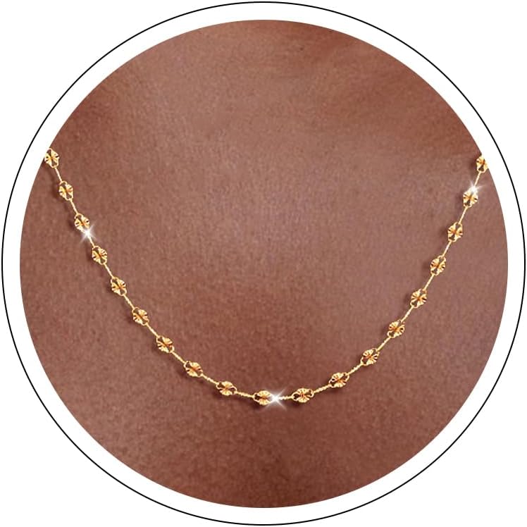 Fine flat mirror-link chain necklace worn at the collarbone
