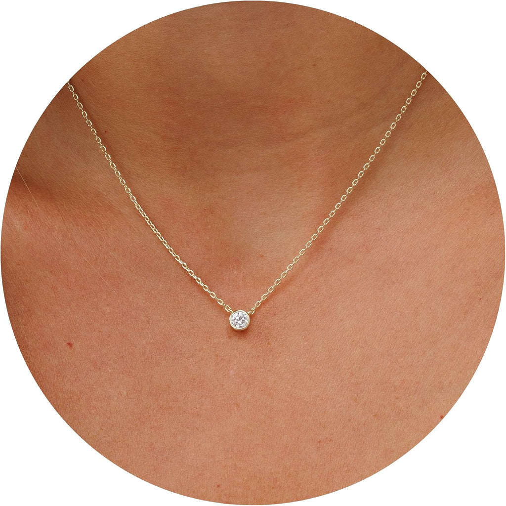 Dainty necklace with one round stone in a bezel on a fine chain