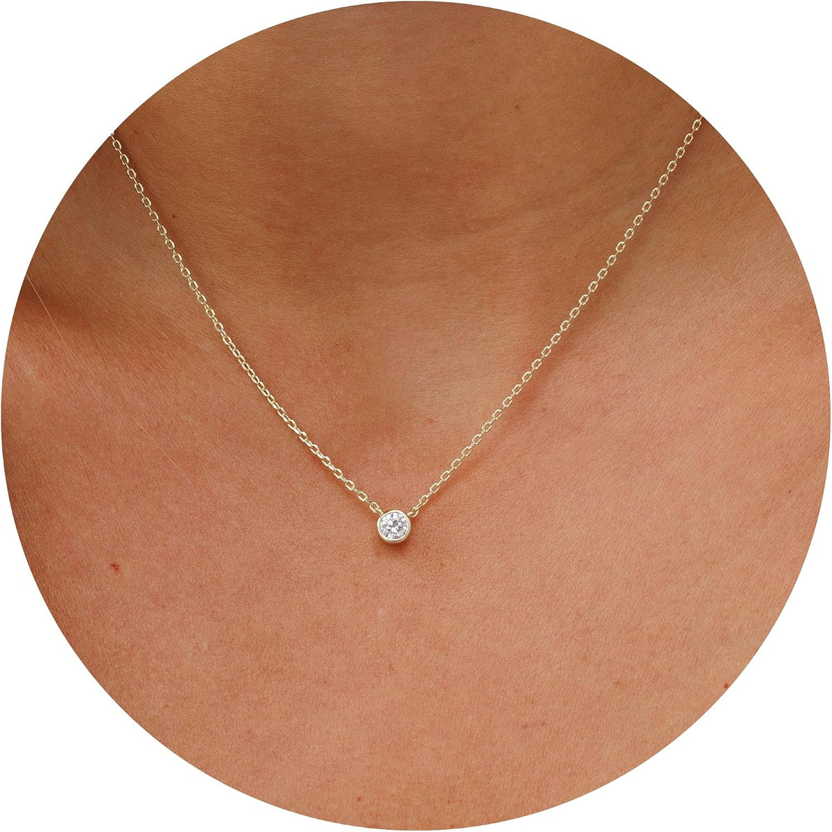 Dainty necklace with one round stone in a bezel on a fine chain