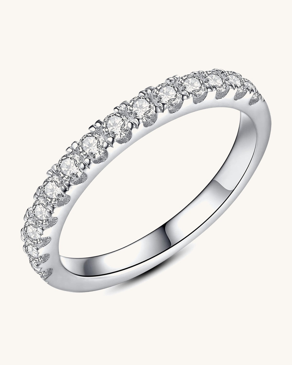 Half eternity band with round stones prong set across the front