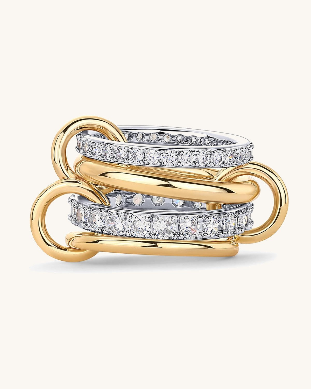 Multi band ring with four linked bands, two set with stones