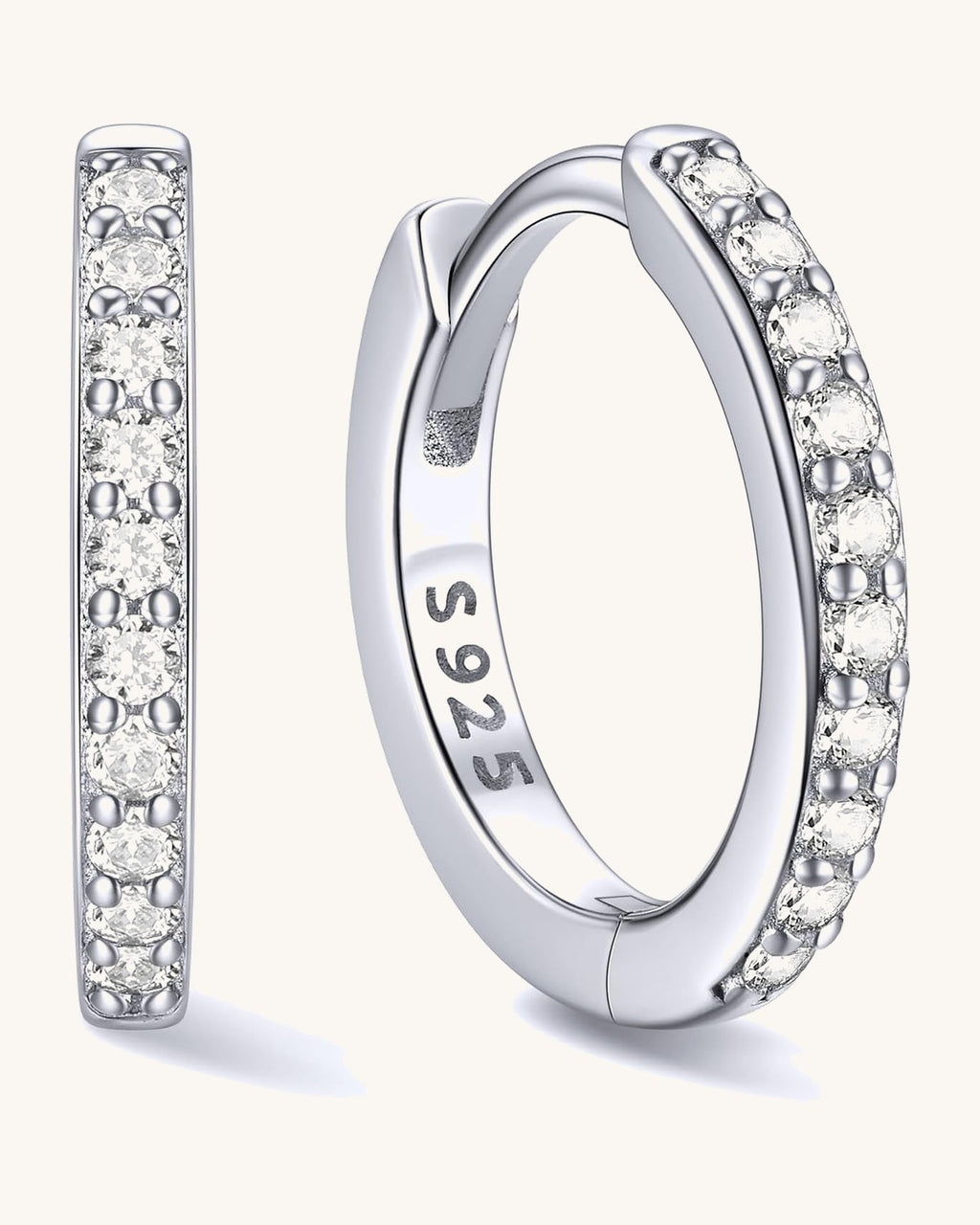 Hinged huggie hoop earrings set with a row of clear stones