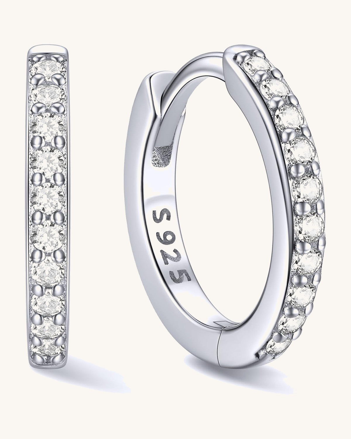 Hinged huggie hoop earrings set with a row of clear stones