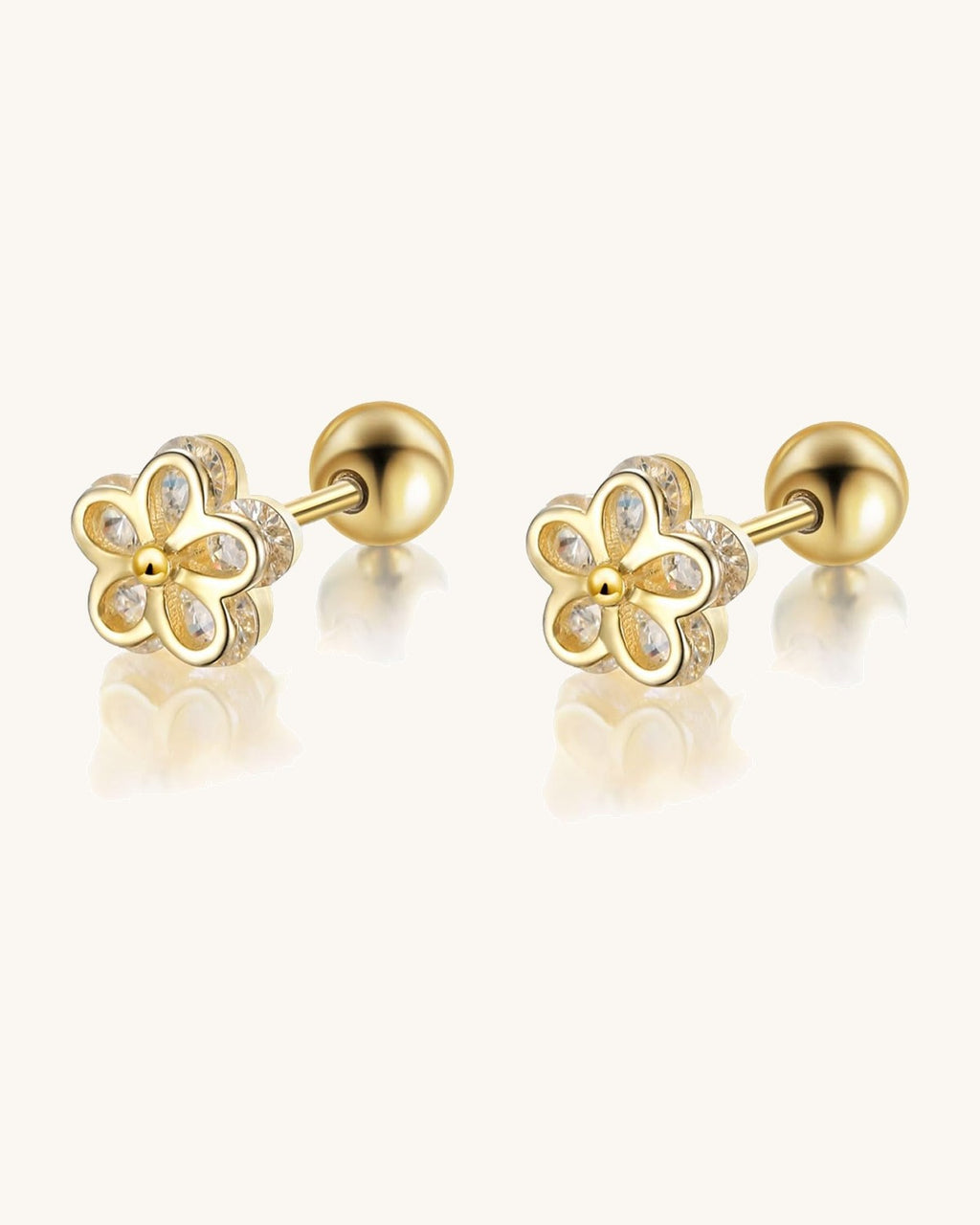 Small gold-tone stud earrings with a screw-on ball back