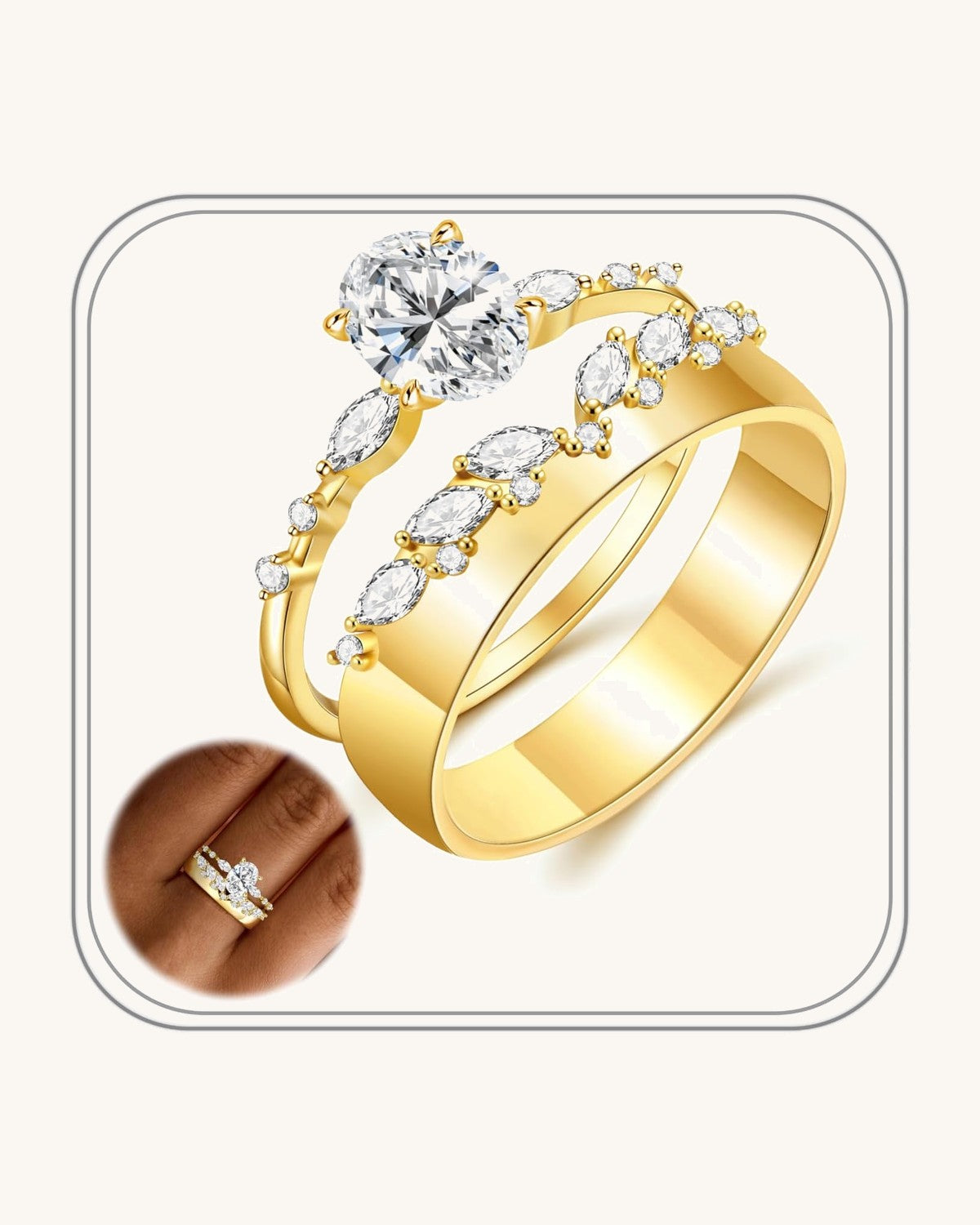 Two slim gold-tone stacking bands, one set with an oval stone
